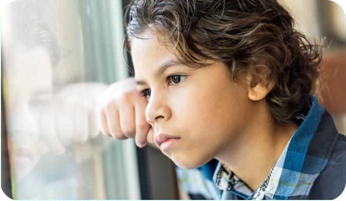 Image: Little Boy Looking Out The Window
