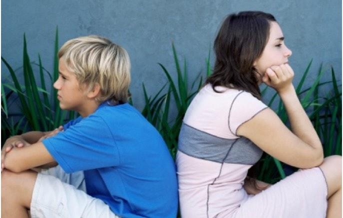 Image: Boy and Girl Sitting Back-to-Back